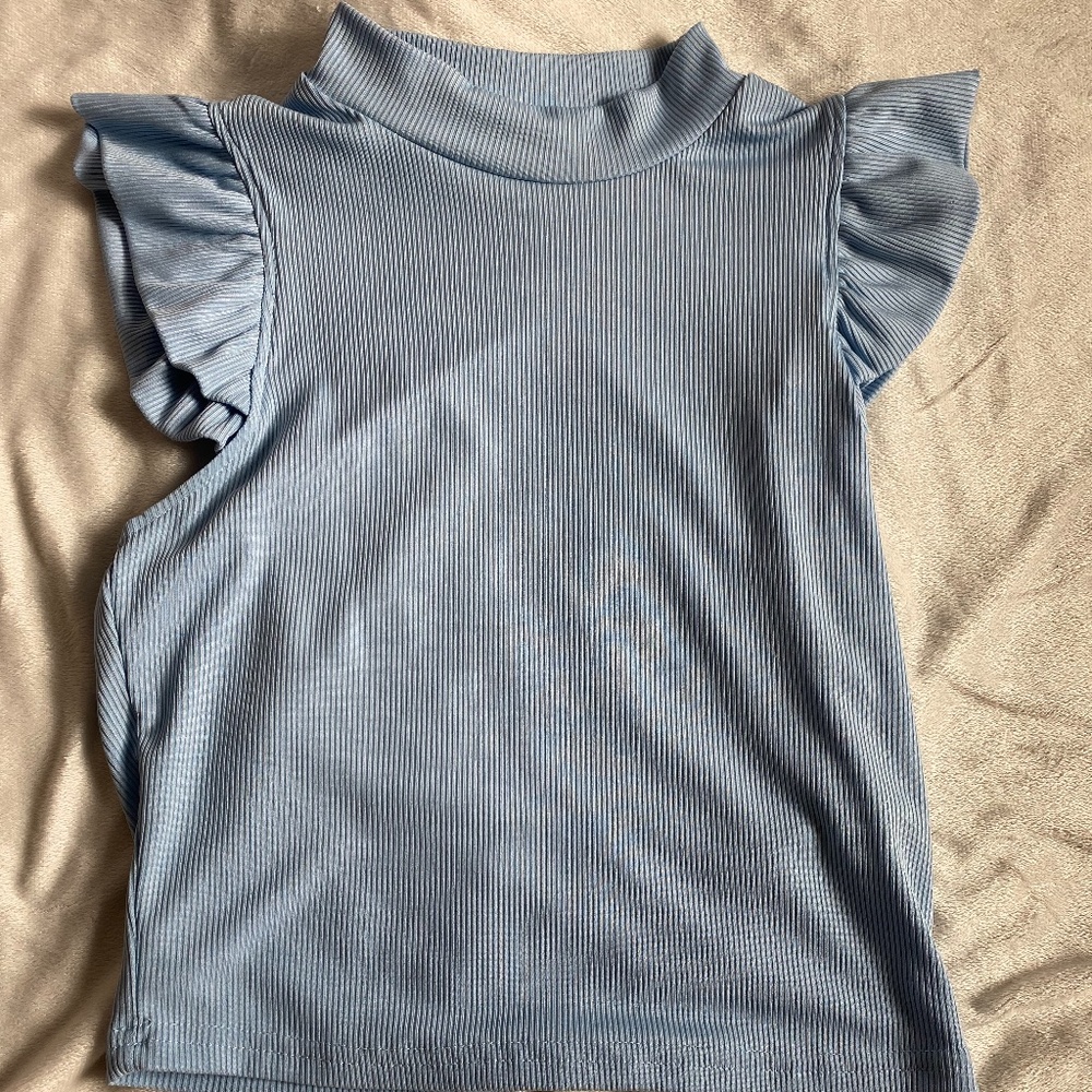Blue ruffle shoulder top